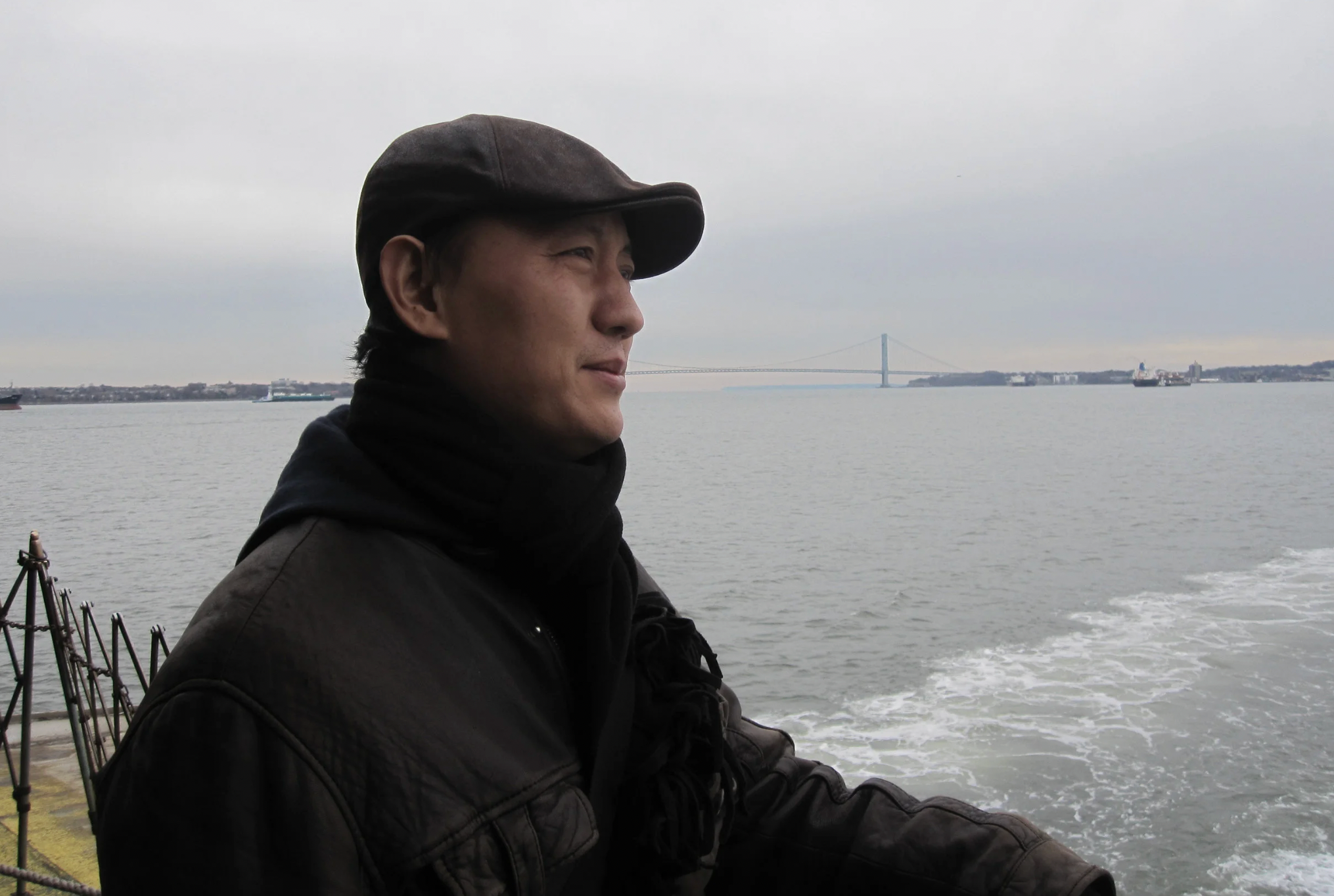 Tong Luo standing by the water